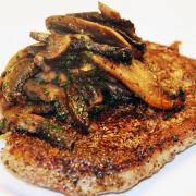 Pepper and mustard rib-eye steak with fried mushroomsthere