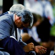 CAN'T BEAR TO WATCH: England manager Bobby Robson hangs his head after his team's elimination from the Italia 90 World Cup on penalties to West Germany. Photo Credit should read: Peter Robinson/EMPICS.