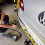 A Volkswagen Passat CC car is tested for its exhaust emissions. Picture: John Stillwell/PA Wire
