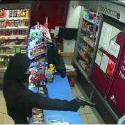 The terrifying moment a man demands money from a cashier in a Darlington corner shop. Picture: SEEMA OFF-LICENCE/CHARLOTTE BOWE