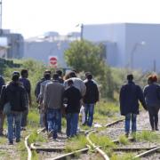 Migrants make their way through Calais. Picture: Gareth Fuller/PA Wire