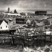 COASTAL COLLIERY: A dramatic picture of Easington Colliery in 1994 before the dominant pithead was demolished