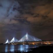 A view of the new Queensferry Crossing, seen from South Queensferry, as it is illuminated ahead of it's official opening by Queen Elizabeth II on September 4, 2017