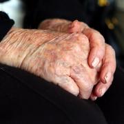 A care home manager left a resident lying in his own faeces and urine, a misconduct panel has heard.