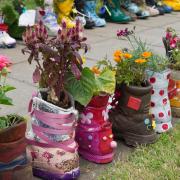 CREATIVE: Soldiers boots have been used as planters in Dishforth, North Yorkshire. Picture: RHS/PA