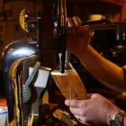 A pint of lager being pulled in a pub. Picture: PA