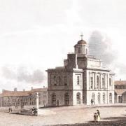RIGHT TRACK: Darlington's town hall seen from High Row, with the market behind, in about 1828. Exactly 200 years ago, the idea for a railway to the south Durham coalfield was considered here