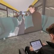 A child operating the Blue Room, a virtual reality suite that allows specialists to create a safe environment for children with autism to work their way through scenarios and confront their fears with the help of a therapist. Picture: Third Eye