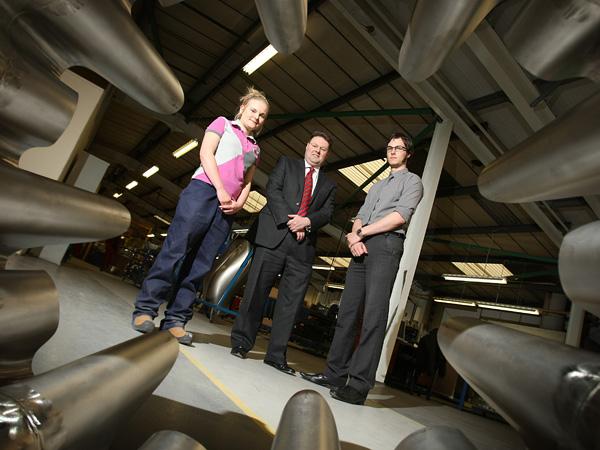 GREAT POTENTIAL: Graham Payne, managing director of Darchem, flanked by apprentices James Watmore and Libby Johnson