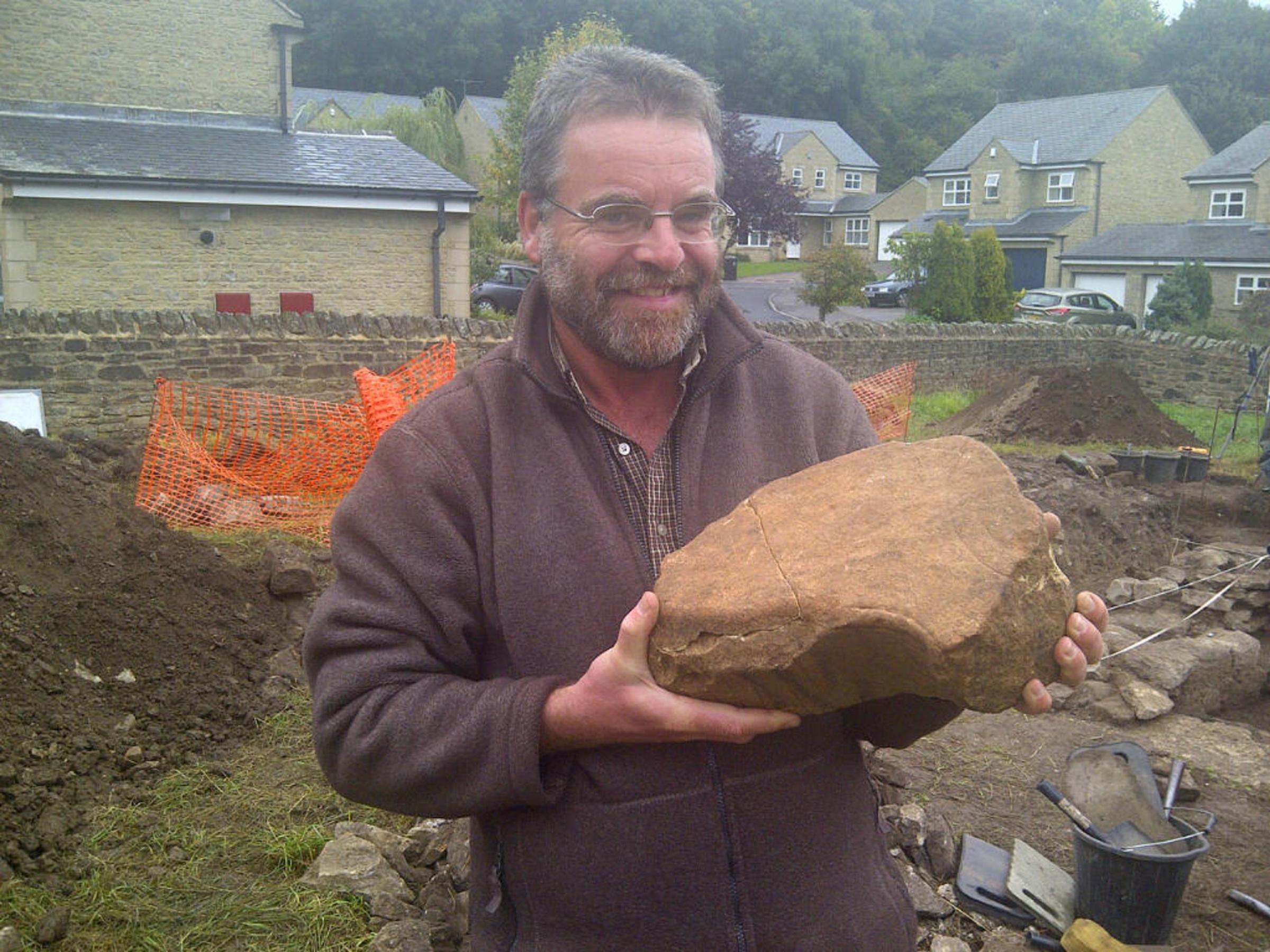 Paul Frodsham, of the AONB Partnership, shows off the section of an Anglo Saxon cross unearthed during a dig in Frosterley Paul Frodsham, of the AONB Partnership, shows off the section of an Anglo Saxon cross unearthed during a dig in Frosterley