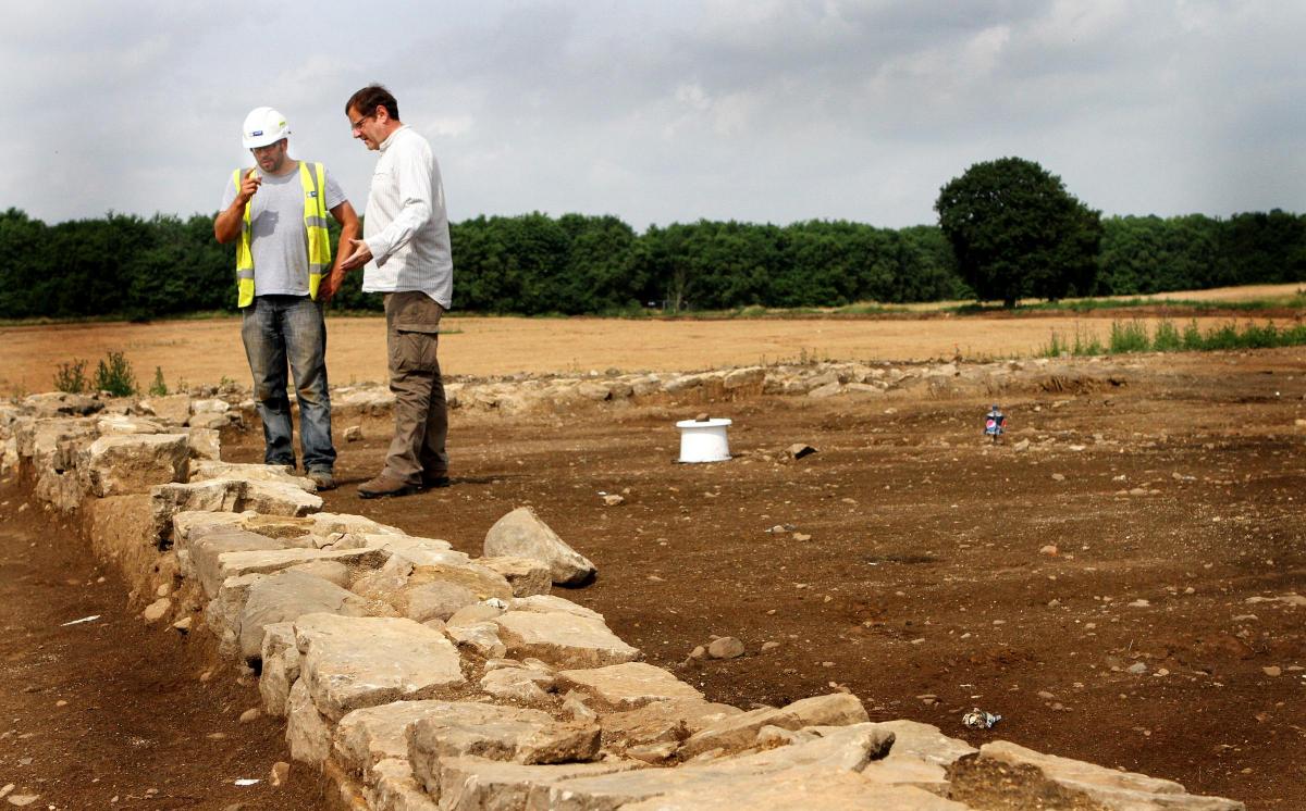 July 25, 2013: Archaeologist and Project officer Damion Churchill shows MP Phil Wilson the 20 Saxon roundhouses and axe heads etc which have been found on the site of the new Hitachi factory in Newton Aycliffe.