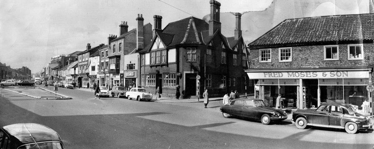 Fred Moses and Son had their furniture shop on the corner of Bondgate and Commercial Street on May 19, 1965, when this picture was taken. Next to the left of the Tap and Spile is a Wimpy Bar
