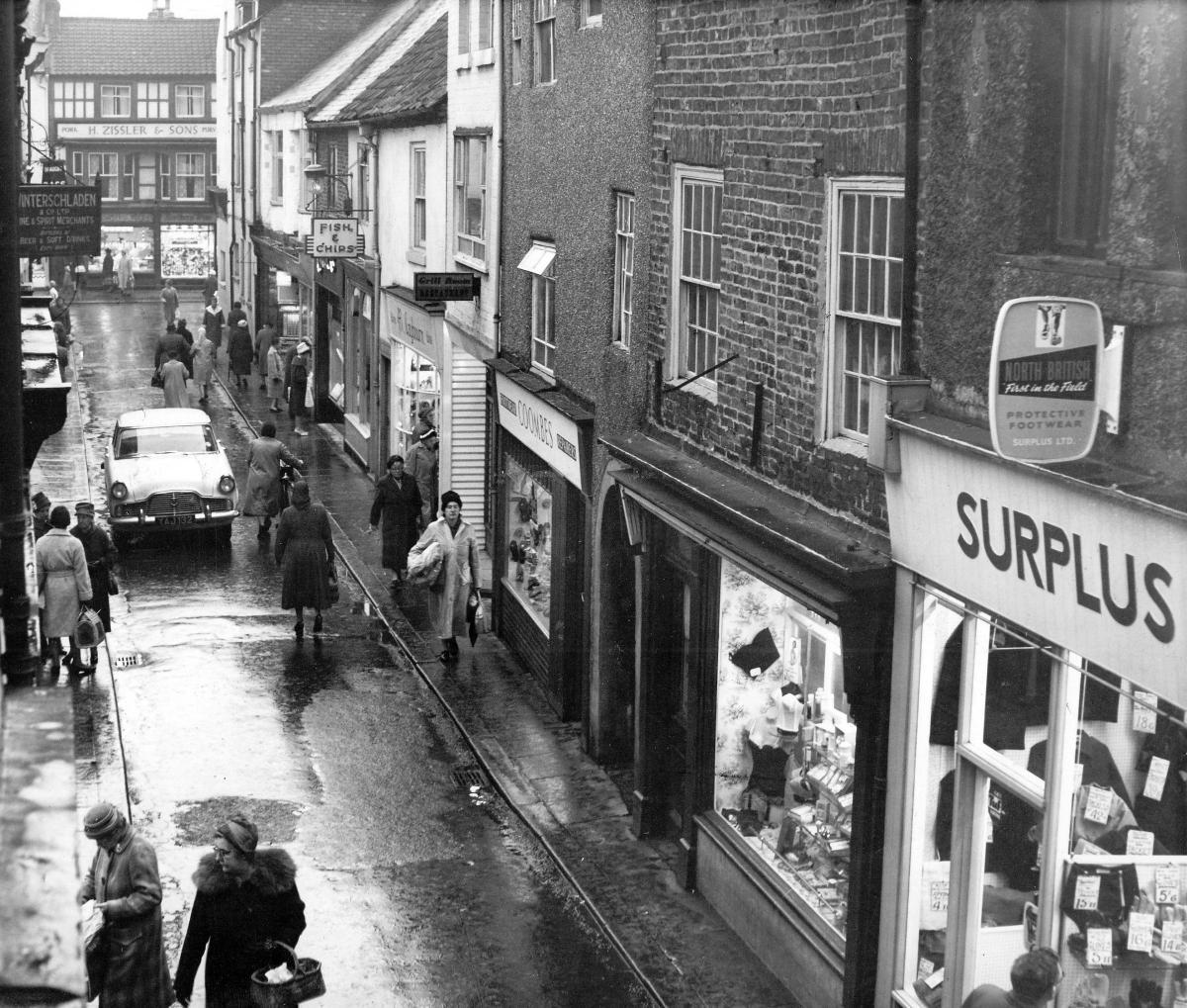WET DAY IN THE WYND: Post House Wynd, Darlington, on December 7, 1961, when cars had unrestricted access to this narrow street