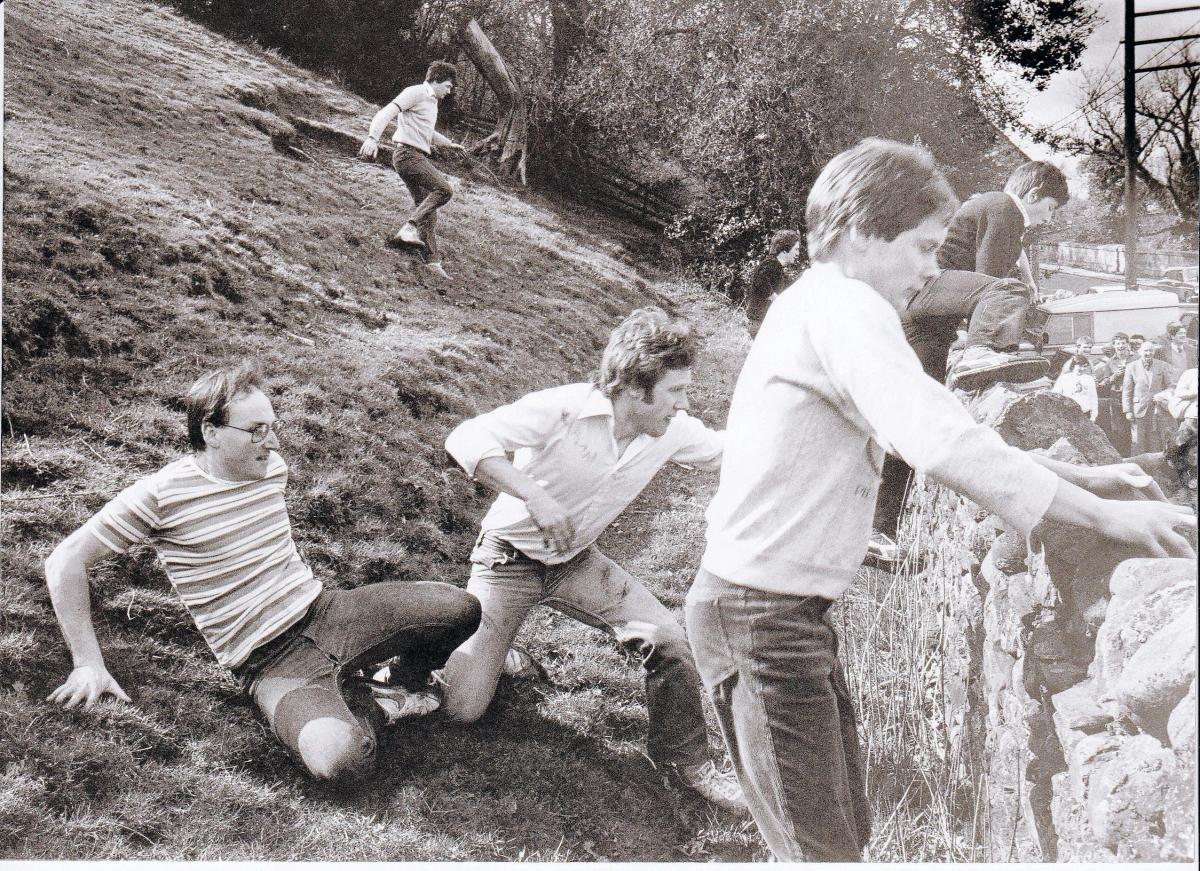 Leaping the wall to return to The George Hotel, again as part of the Easter Monday Handicap, this time in 1983. The drop on the other side of the wall is about 8ft
