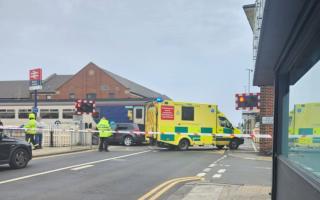 LIVE: Emergency services on scene train hits car on level crossing