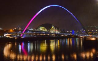 The Gateshead Millennium bridge over the river Tyne in Newcastle lit up in the colours of the Tricolour showing its support and solidarity for the victims of the Paris Attacks. Picture: NORTH NEWS
