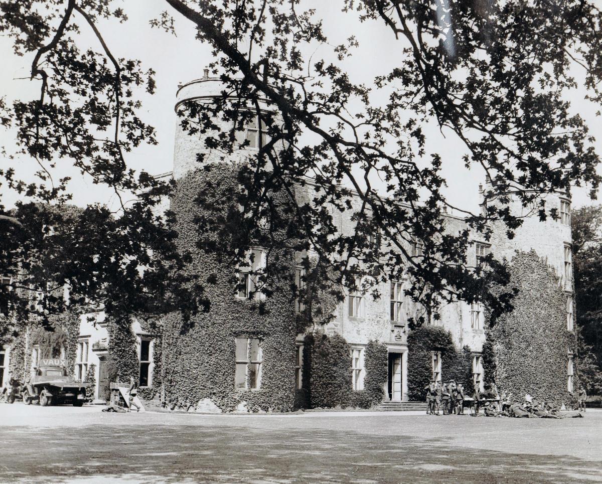 A brilliant picture of the 16th Century Grade 1 listed Walworth Castle, taken on May 22, 1938, when the castle was owned by the Eade family. Soldiers lounge rather casually on the lawn on the right. A Vaux wagon is at the front door to the left.