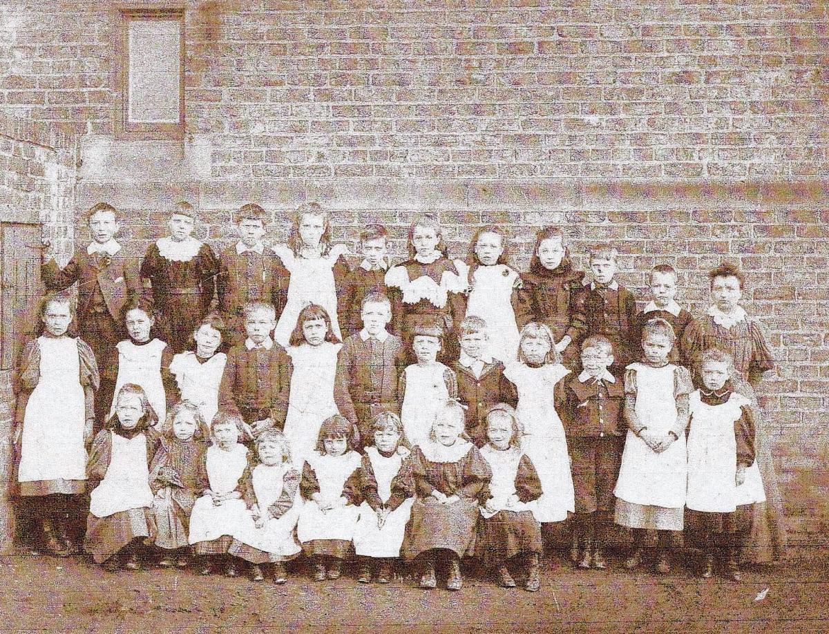 YES MISS: Teacher Kate Buckton is at the right of the back row of this early 1900s photo. She taught for many years at Haughton School. When Sonny Scarth started in the late 1920s, Kate told him she remembered teaching his mother.