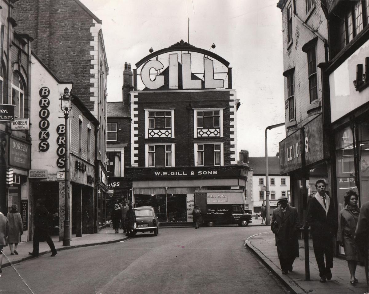 WE Gill and Son’s house furnishing shop at the end of Newgate Street was absolutely unmissable due to the enormous lettering on the roof. A few years after this picture was taken on February 25, 1964, this distinctive building was replaced by the Newgat