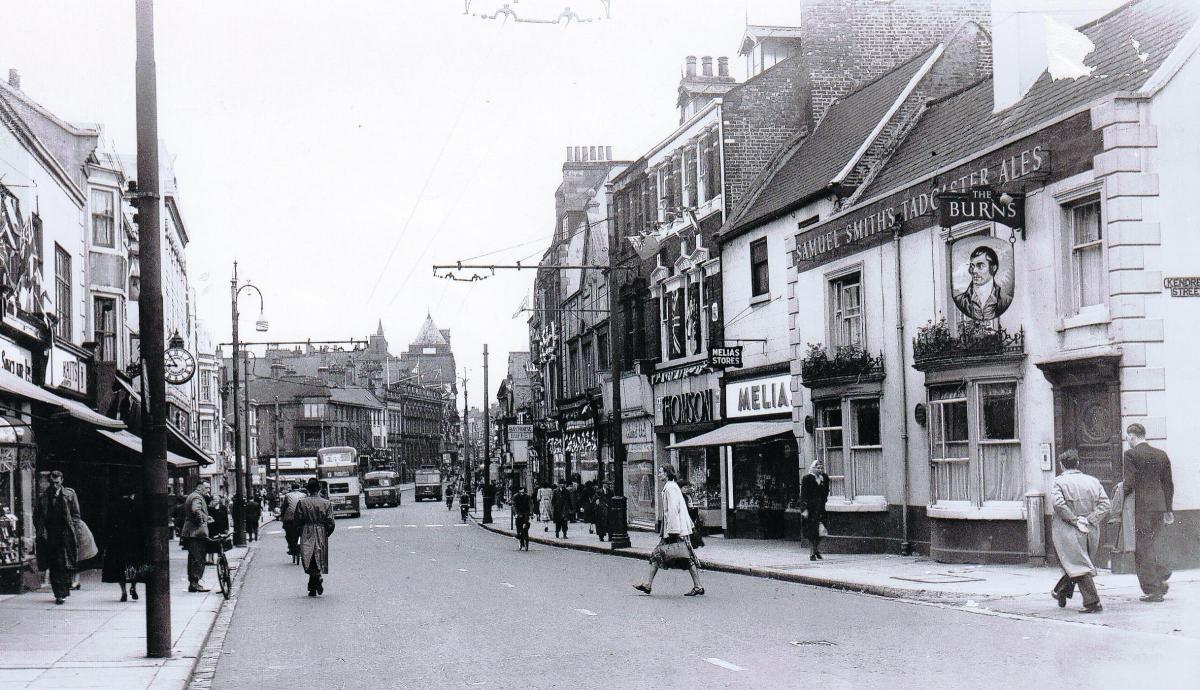 Looking south down Northgate towards the King's Head Hotel in the early 1960s – trolley buses are still running. All the buildings in the foreground, including the Bay Horse and the Burns pubs – have been demolished