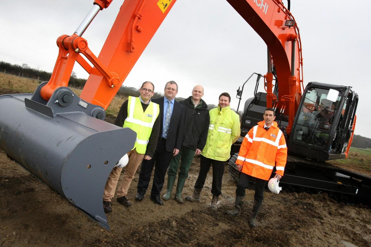 April 26, 2013: A digger moves the first earth on the site of the Hitachi train factory in Newton Aycliffe. Frank Giecco; Darren Cumner, Plant manager for Hitachi; Bill Grafton of Merchant Place developments; Mark Bickle, a partner at Michael Eyres partne