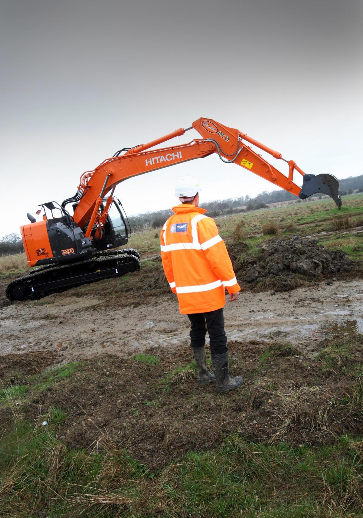 April 26, 2013: Martin Railton, a project manager from Wardell Armstrong Archaeology, watches as a digger moves the first earth on the site of the Hitachi train factory in Newton Aycliffe.