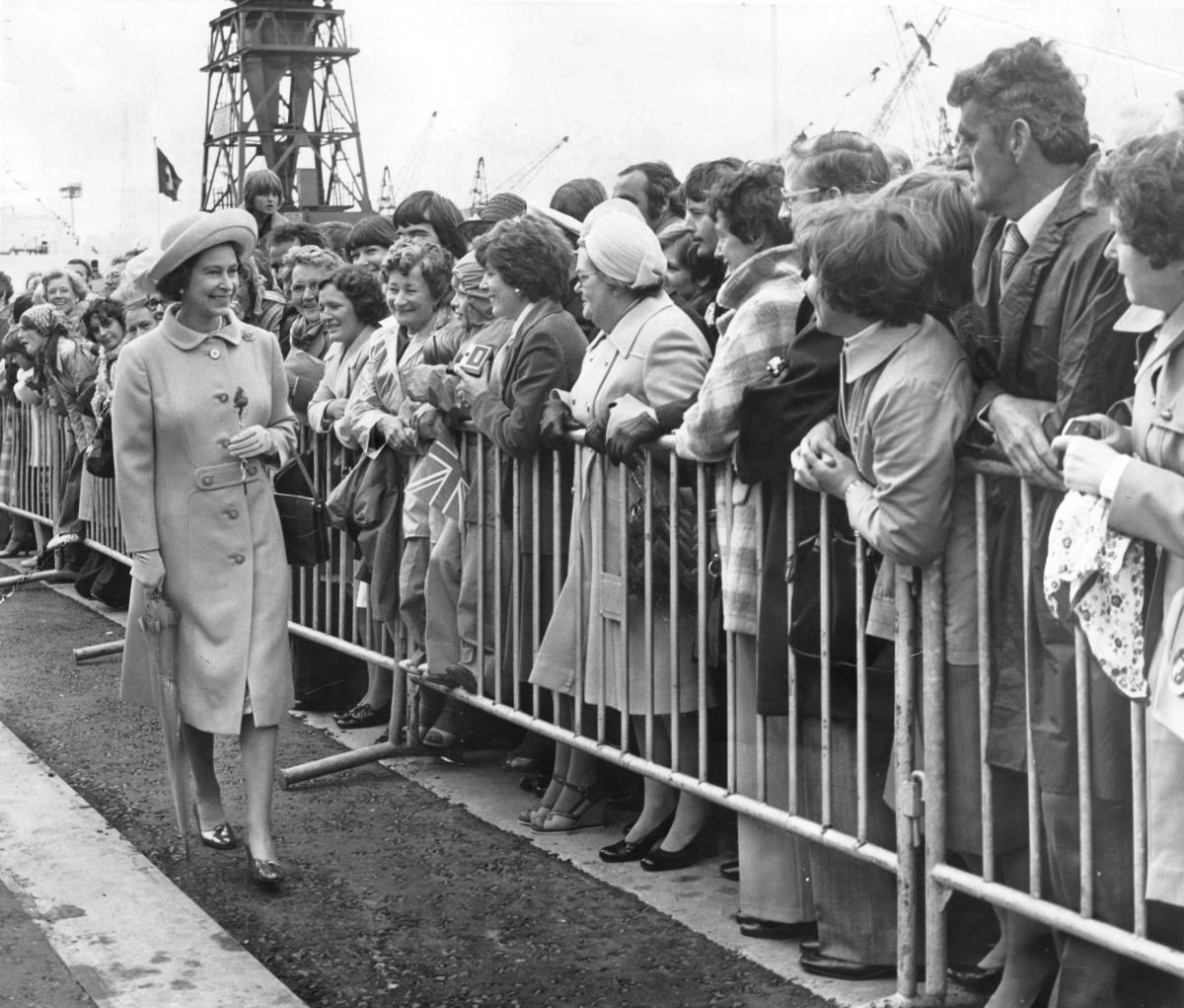 Queen Elizabeth disembarks from the Royal yacht, Britannia, at Tees Dock, Middlesbrough during her Silver Jubille tour of the region