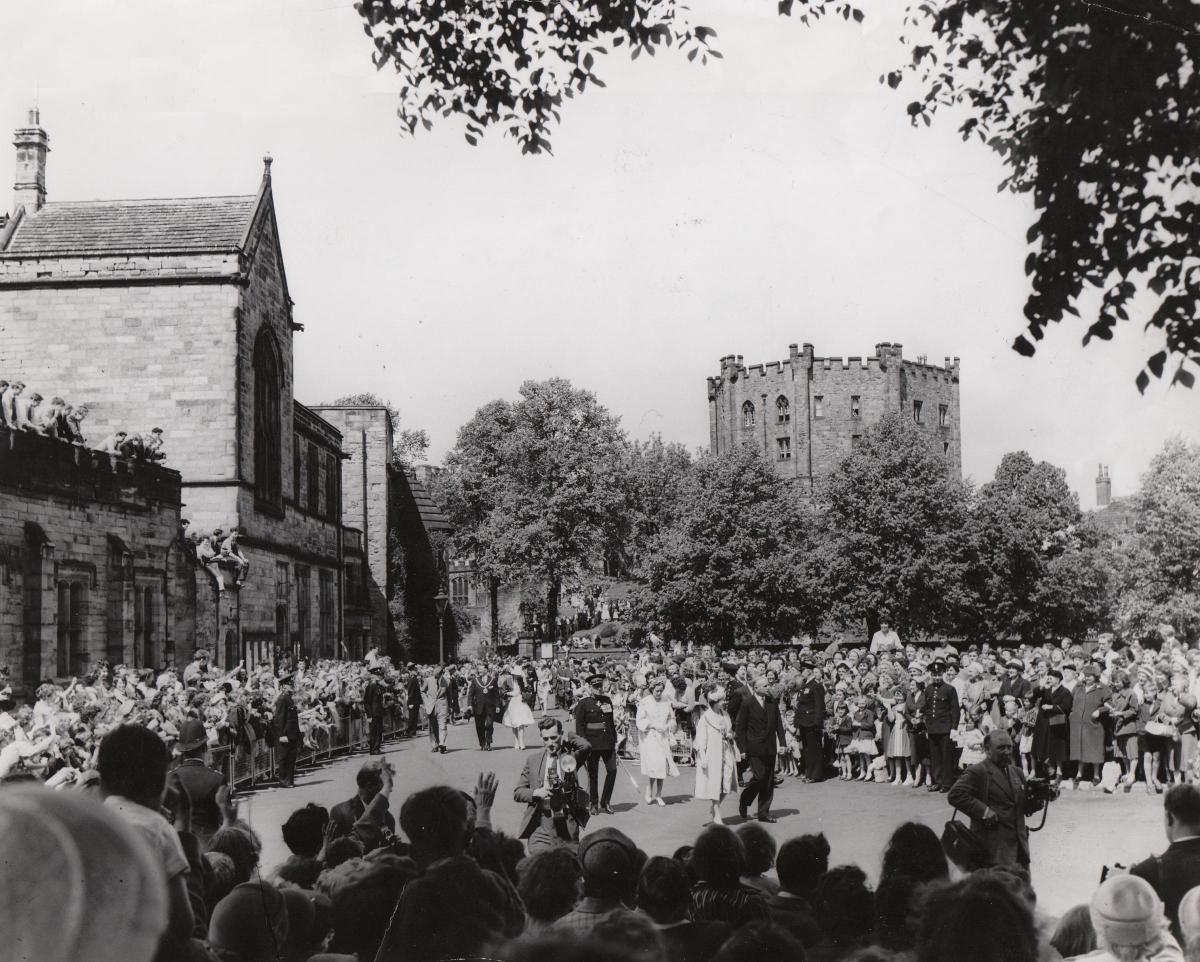 The Queen is welcomed onto Palace Green, with Durham Castle towering behind her, as part of the 1960 visit