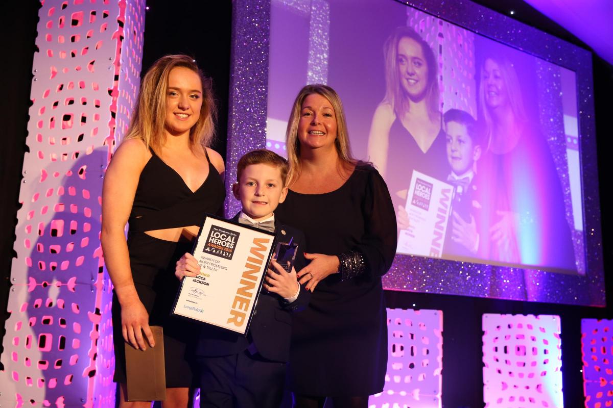 Lucca Jackson, winner of the Most Promising New Talent Award, sponsored by Longfield School, Darlington, collects his award from Rio bronze medallist Amy Tinkler and Longfield School headteacher, Susan Johnson.