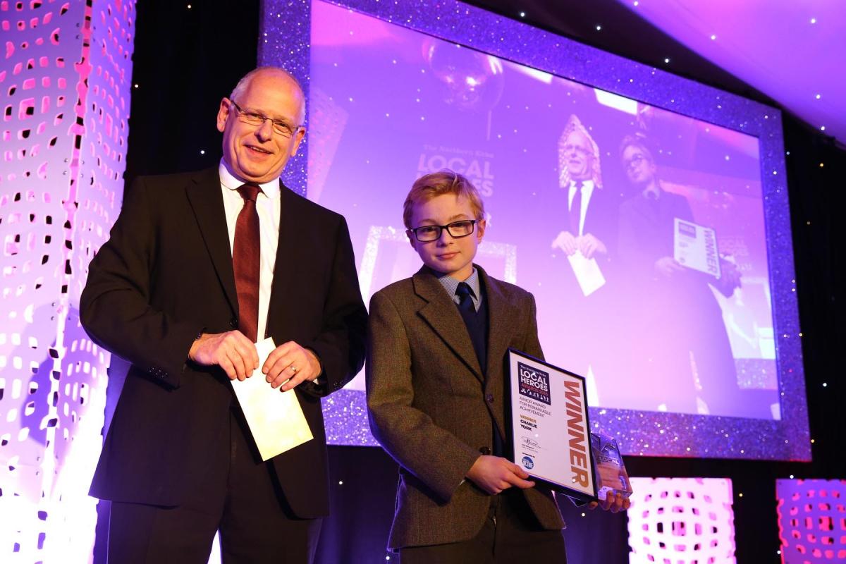 The first award of the evening Remarkable Achievement in the junior category, sponsored by Tees Active, goes to 11-year-old Charlie York, dubbed the Bedale Bolt. Picture: CHRIS BOOTH