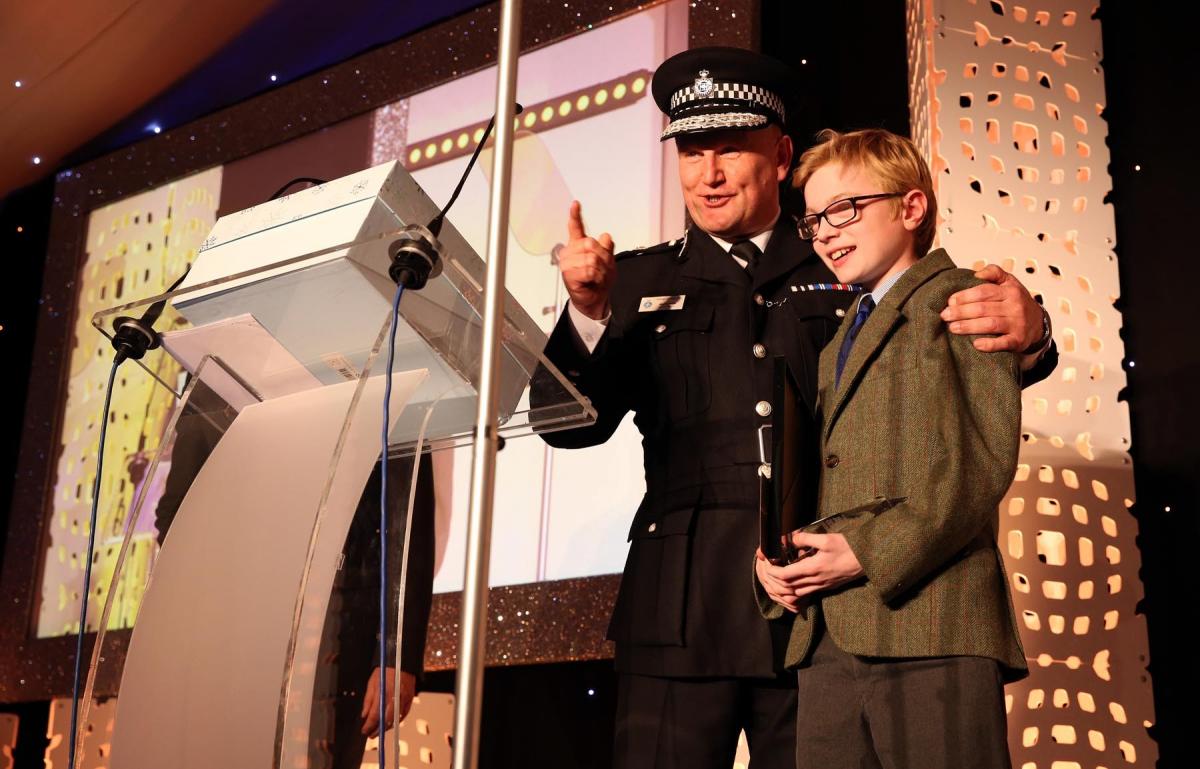 Chief Constable of Durham Constabulary, Mike Barton, presents Charlie with a signed copy of the Police Interceptors 2017 calendar after the 11-year-old expressed dreams of becoming a police officer. Picture: CHRIS BOOTH