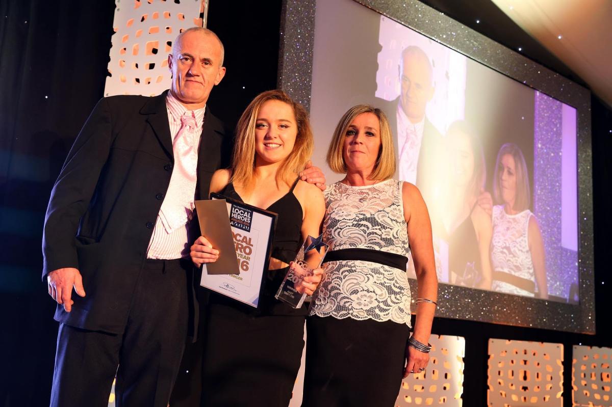 Overall winner and local hero for 2016, Rio bronze medallist Amy Tinkler, is presented with the award by Stephen and Allison Johnson, parents of Stephen Johnson, wheelchair basketball star who died earlier this year. Picture: CHRIS BOOTH