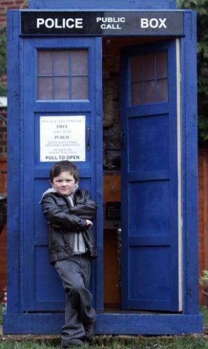 LOST FOR WORDS: Dr Who fan Nathan Taylor, six, with the full-scale replica Tardis  built by his stepfather, Stephen Hudspeth