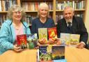 From left, Library Friends Kim Harding, Ros Evans and Chris Foote-Wood have 50 books to give away at the Big Barney Book Hunt on May 28