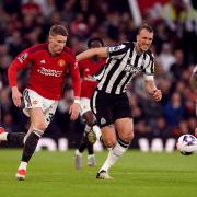 Dan Burn chases down Manchester United midfielder Scott McTominay