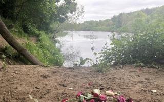 Floral tributes on the banks of the River Tyne.