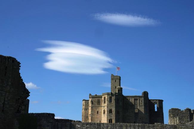 Lenticular clouds over English Heritage’s Warkworth Castle in Northumberland as temperatures are expected to rise over the UK this week															   Picture: OWEN HUMPHREYS/PA WIRE