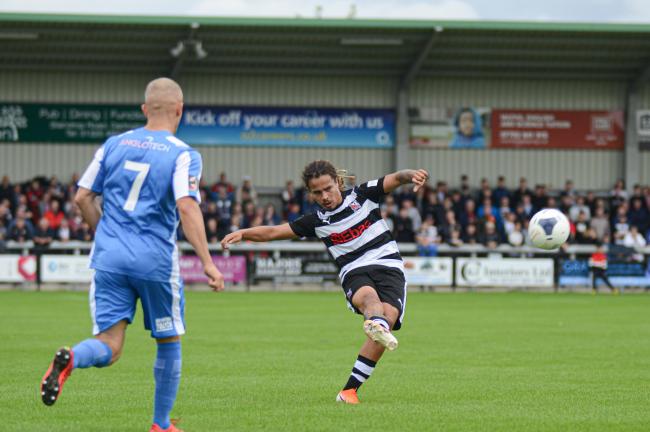 Darlington's Osagi Bascome plays a pass against Kettering Town on Saturday. Picture: TIM HICKMAN