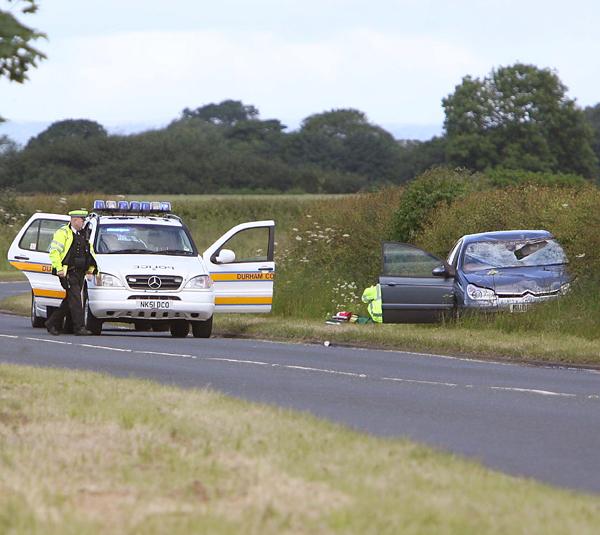 CRASH SITE: Police at the scene of the fatal accident on the A167 near Croft involving a car and two cyclists