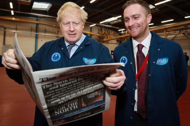 Boris Johnson visits Tetley in Eaglescliffe, he is pictured with Thursday's Northern Echo with Matthew Vickers of Stockton South Picture: SARAH CALDECOTT