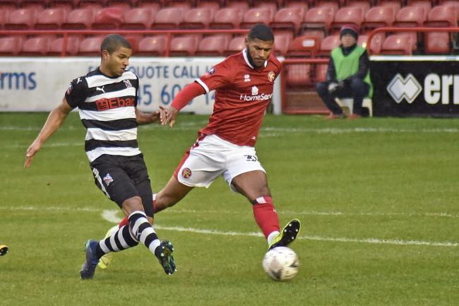 Omar Holness plays a pass during Saturday's 2-2 draw with Walsall. Picture: Jenny Merrett