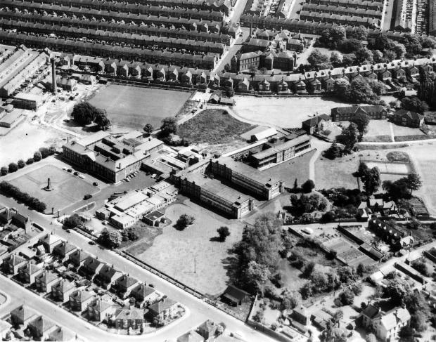 The Northern Echo: Darlington Memorial Hospital in the 1950s. Top left with the chimney is the laundry. Left is the memorial hall and the cenotaph archive. The wards make a U shape and there are a lot of wartime temporary buildings. Bottom right are some of the Victorian villas lining Woodland Road - many of them still have gardens stretching towards the hospital.