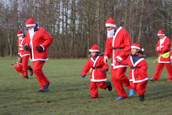The Northern Echo: Richmond MP Rishi Sunak with his children at the santa run. The Northern Echo: Richmond MP Rishi Sunak with his children at the santa run.