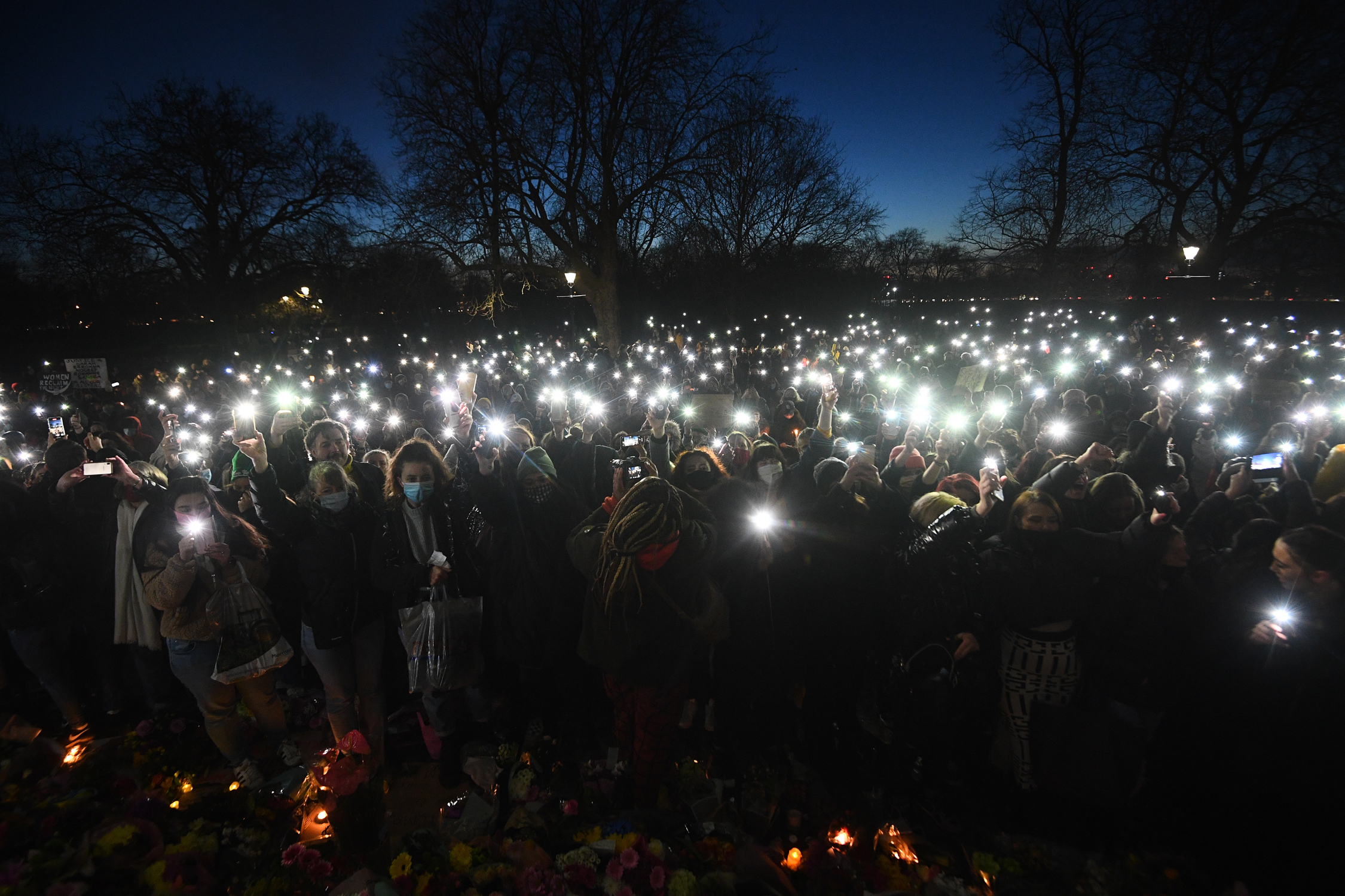 People in the crowd turn on their phone torches in Clapham Common, London, , after the Reclaim These Streets vigil for Sarah Everard was officially cancelled. Serving police constable Wayne Couzens, 48, has appeared in court charged with kidnapping and