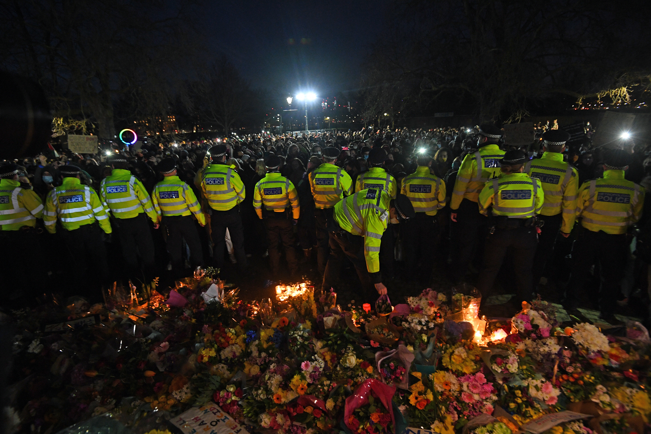 Police surround the band stand in Clapham Common, London, after the Reclaim These Streets vigil for Sarah Everard was officially cancelled. Serving police constable Wayne Couzens, 48, has appeared in court charged with kidnapping and killing the