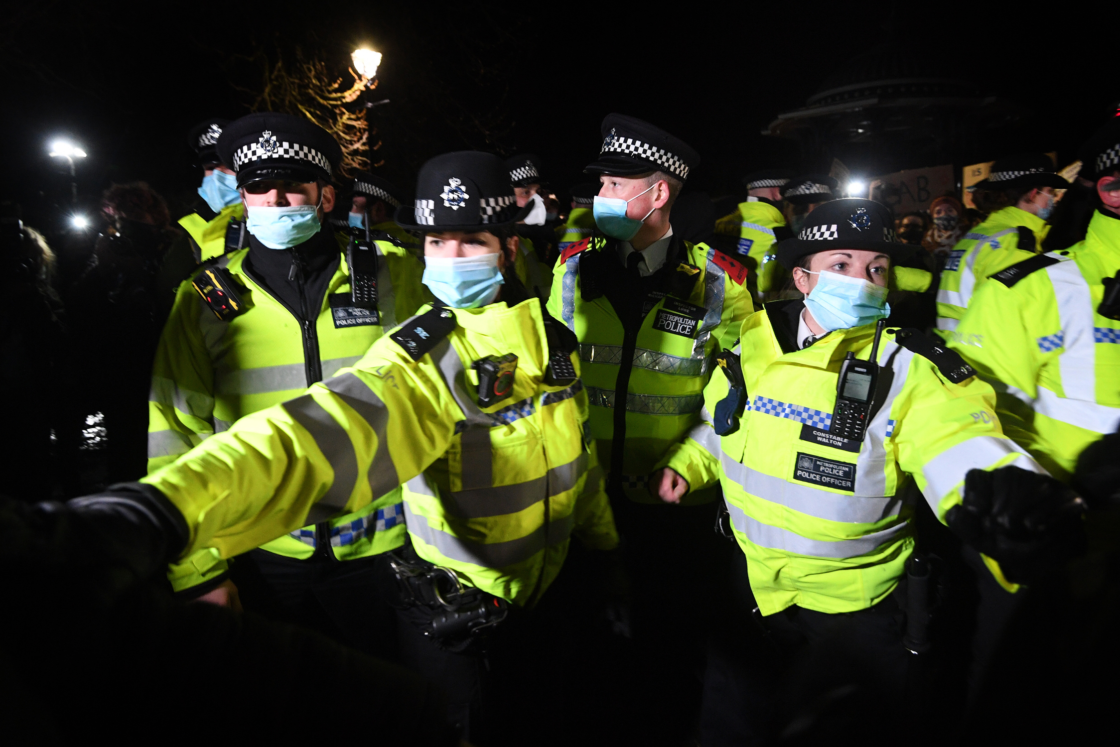 Police officers clash with people as they form a gathering in Clapham Common, London, after the Reclaim These Streets vigil for Sarah Everard was officially cancelled. Serving police constable Wayne Couzens, 48, has appeared in court charged with