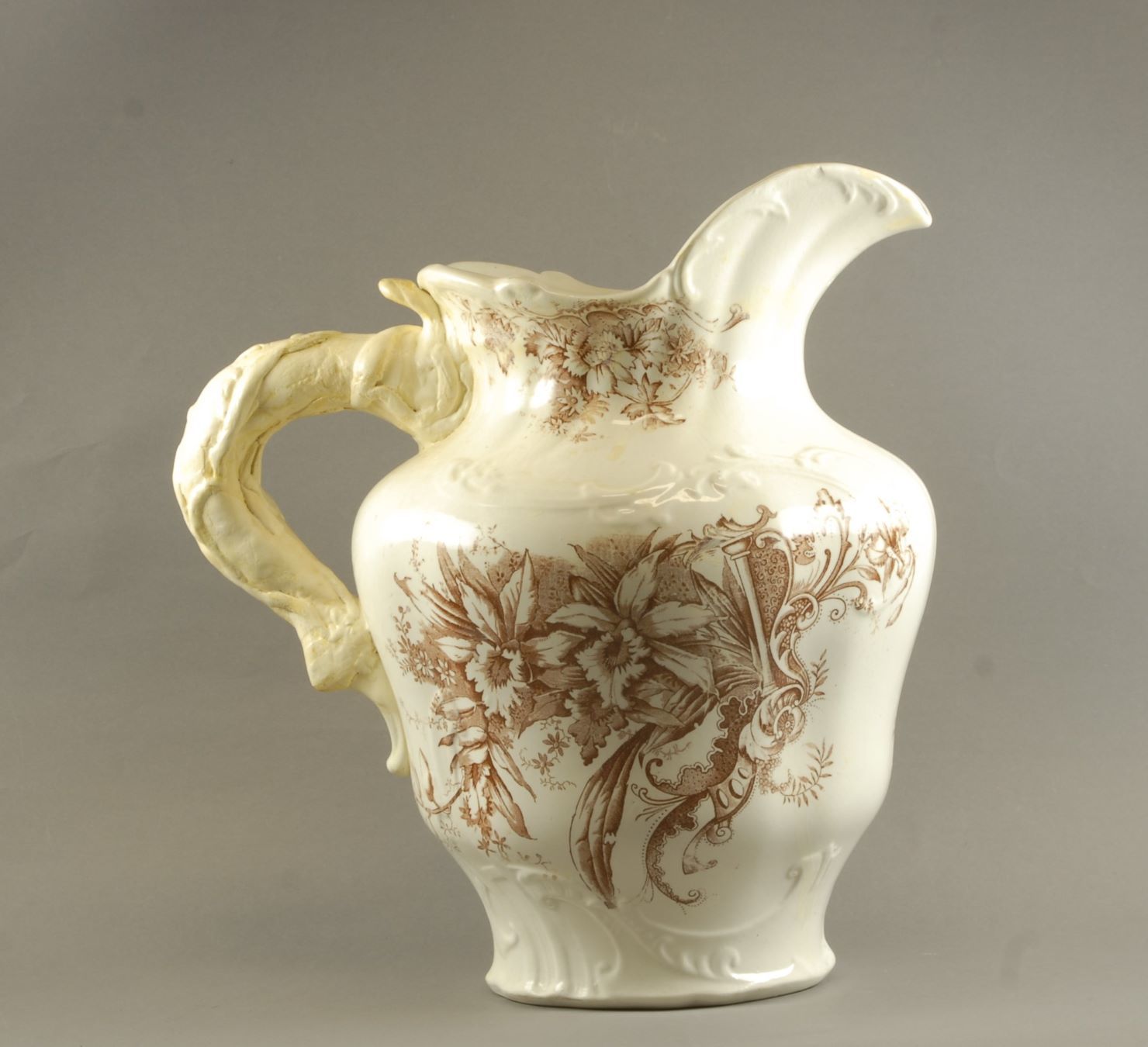 Are historic repairs to this ceramic jug part of its story or should it be restored to its original form? 