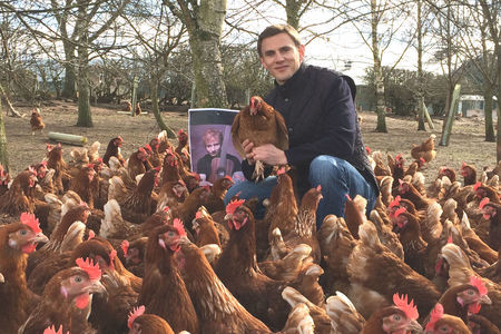 Egg producer Adrian Potter with some of his music-loving hens at the time