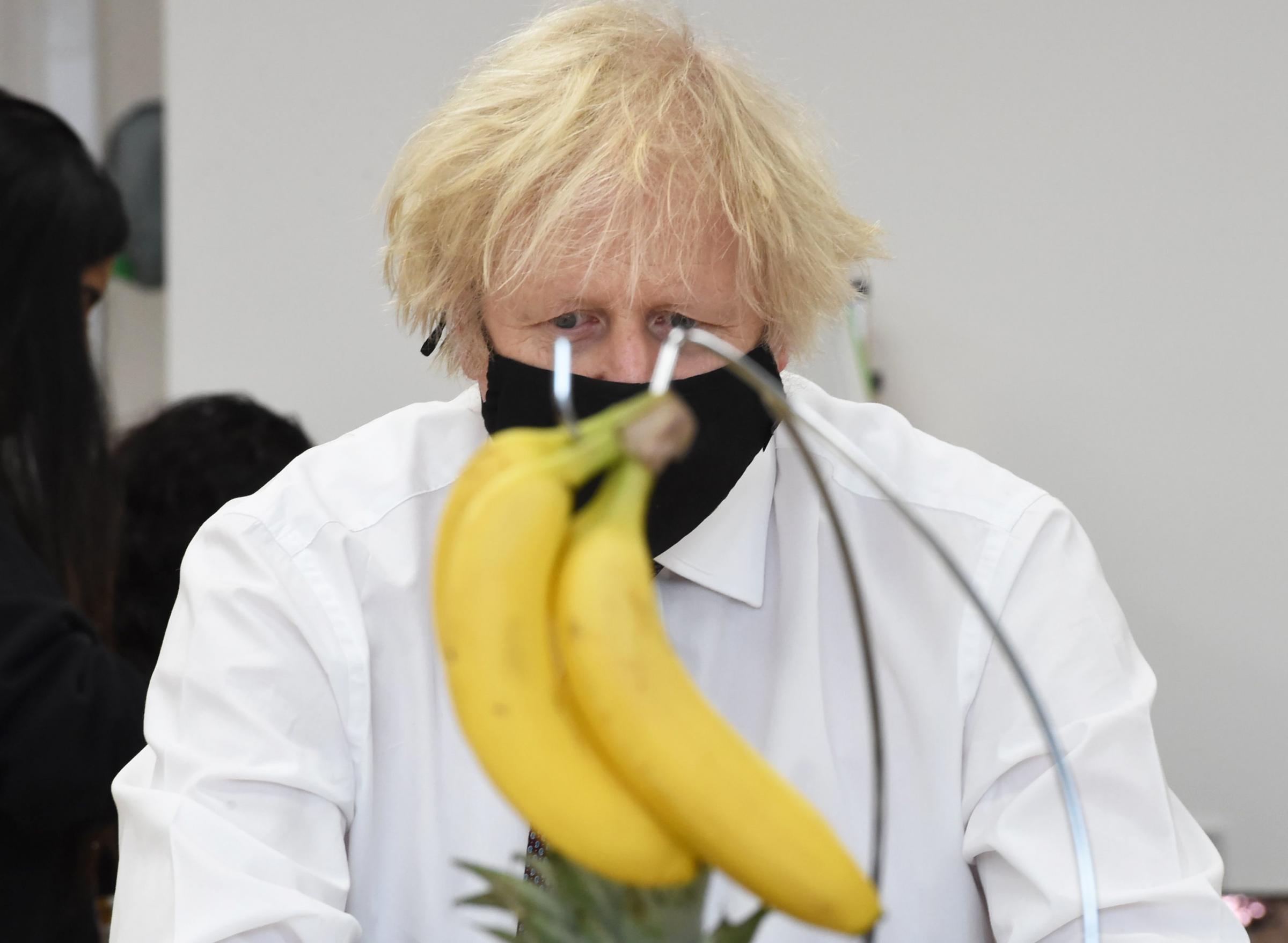 Prime Minister Boris Johnson drawing a bunch of bananas during a visit to the Monkey Puzzle Nursery in Greenford, west London Picture: JEREMY SELWYN/Evening Standard/PA