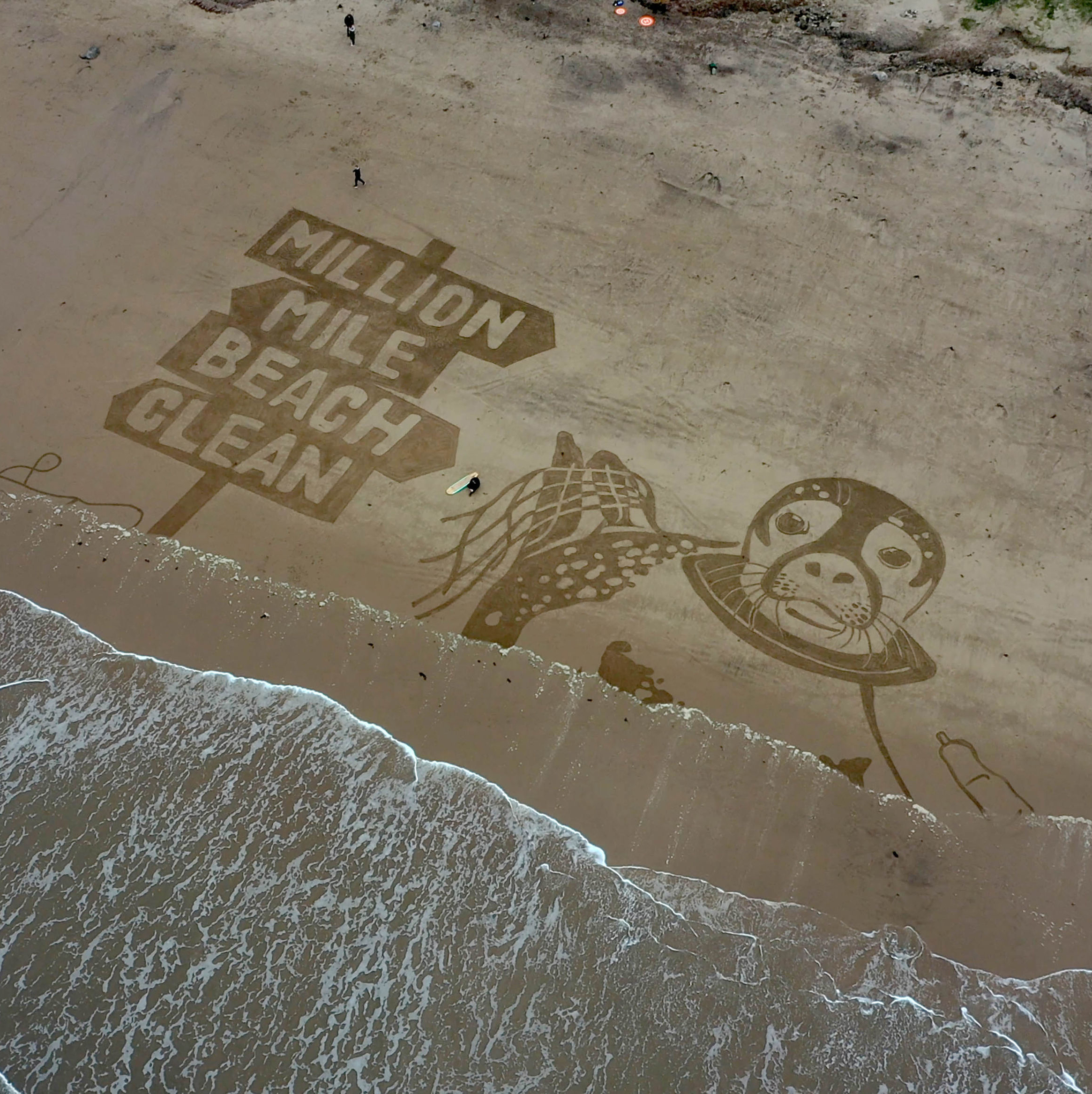 Aerial views of a 50-metre sand drawing created by Sand In Your Eye for Surfers Against Sewages new Million Mile Beach Clean campaign, on Cayton Bay in Yorkshire Picture: RICHARD MCCARTHY/PA.